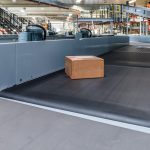 Single parcel transported on automated conveyor
